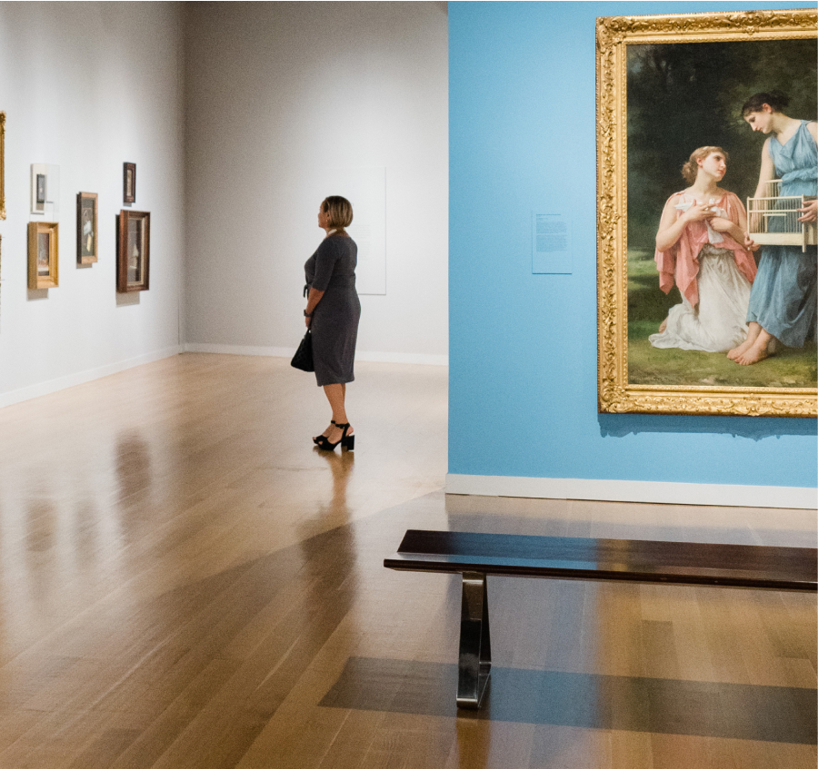 Young woman admiring artwork