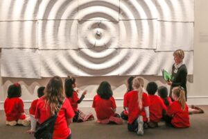 Docent leading a group of students