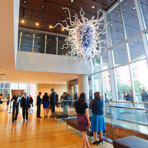 People under Chihuly chandelier