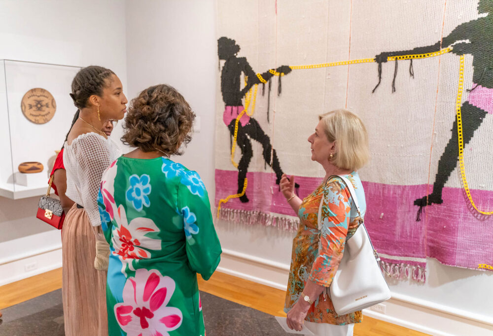 Three women touring the museum