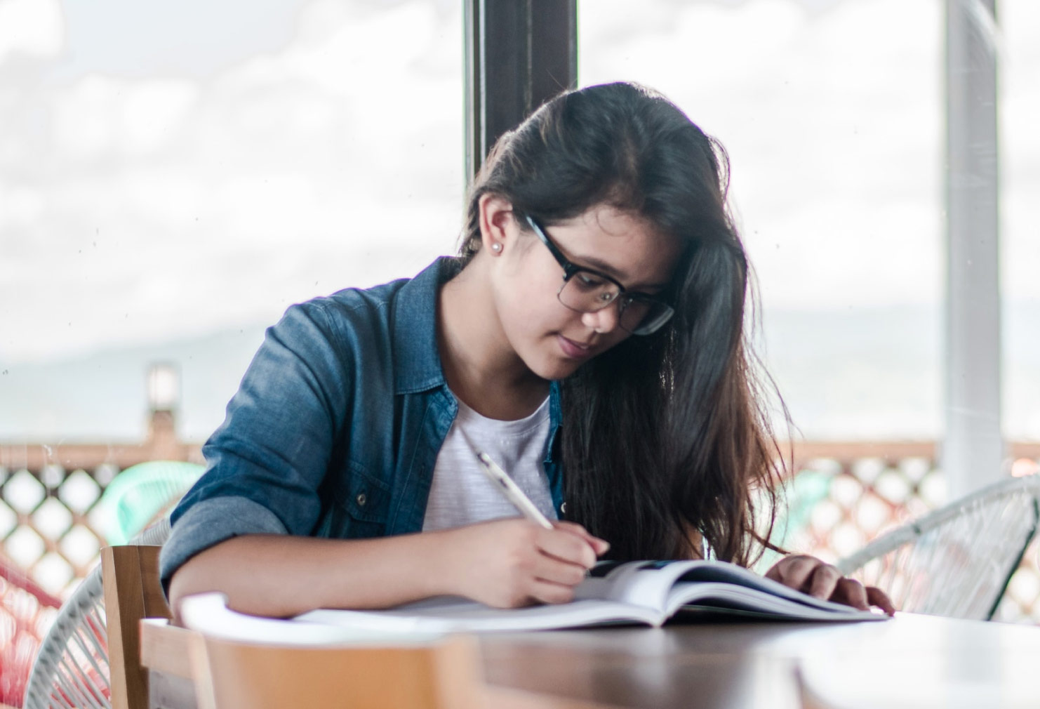 Student writing in notebook