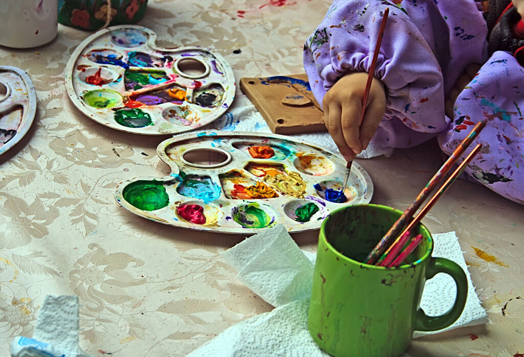 Young girl working on a paint project