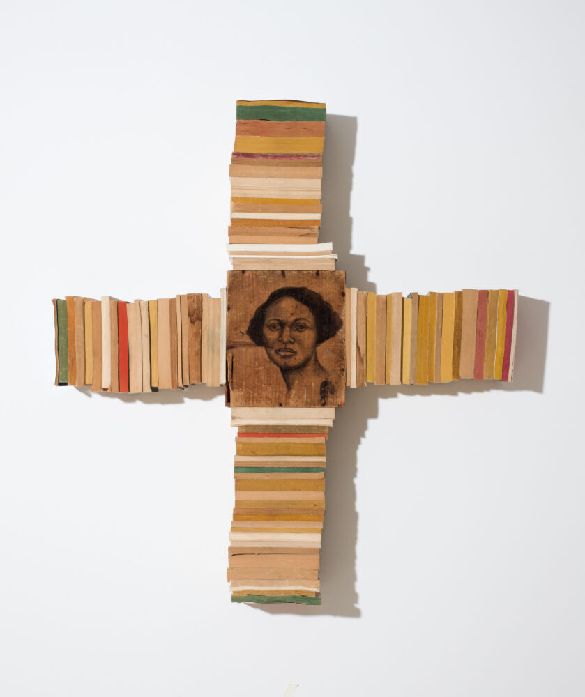 Conté on wood with attached paperback books