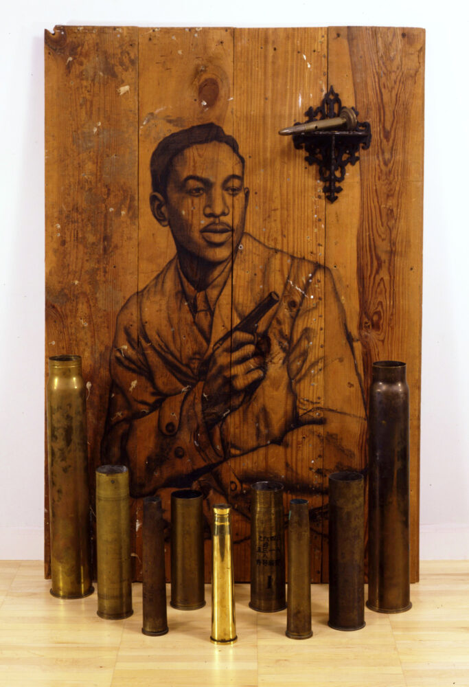 Charcoal on wood, bombshell casings