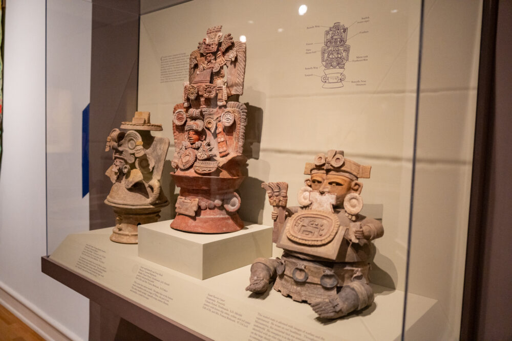 Statues encased in gallery of Arts of Ancient America