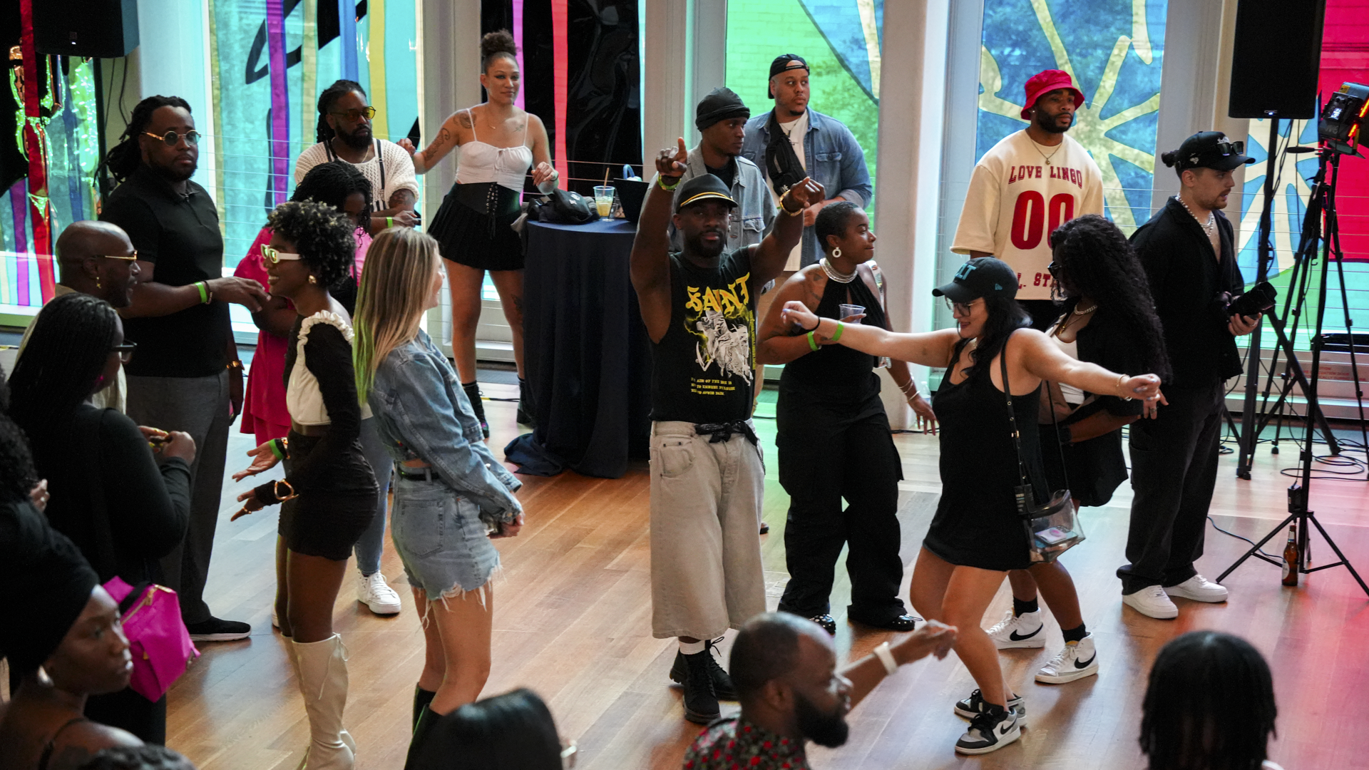 Crowd of people dancing at mint museum uptown's atrium.