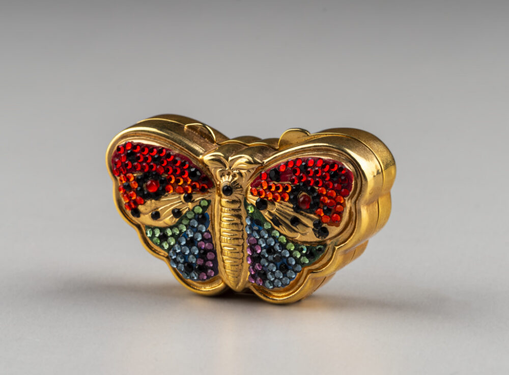 Judith Leiber pill box: rainbow butterfly with gold case